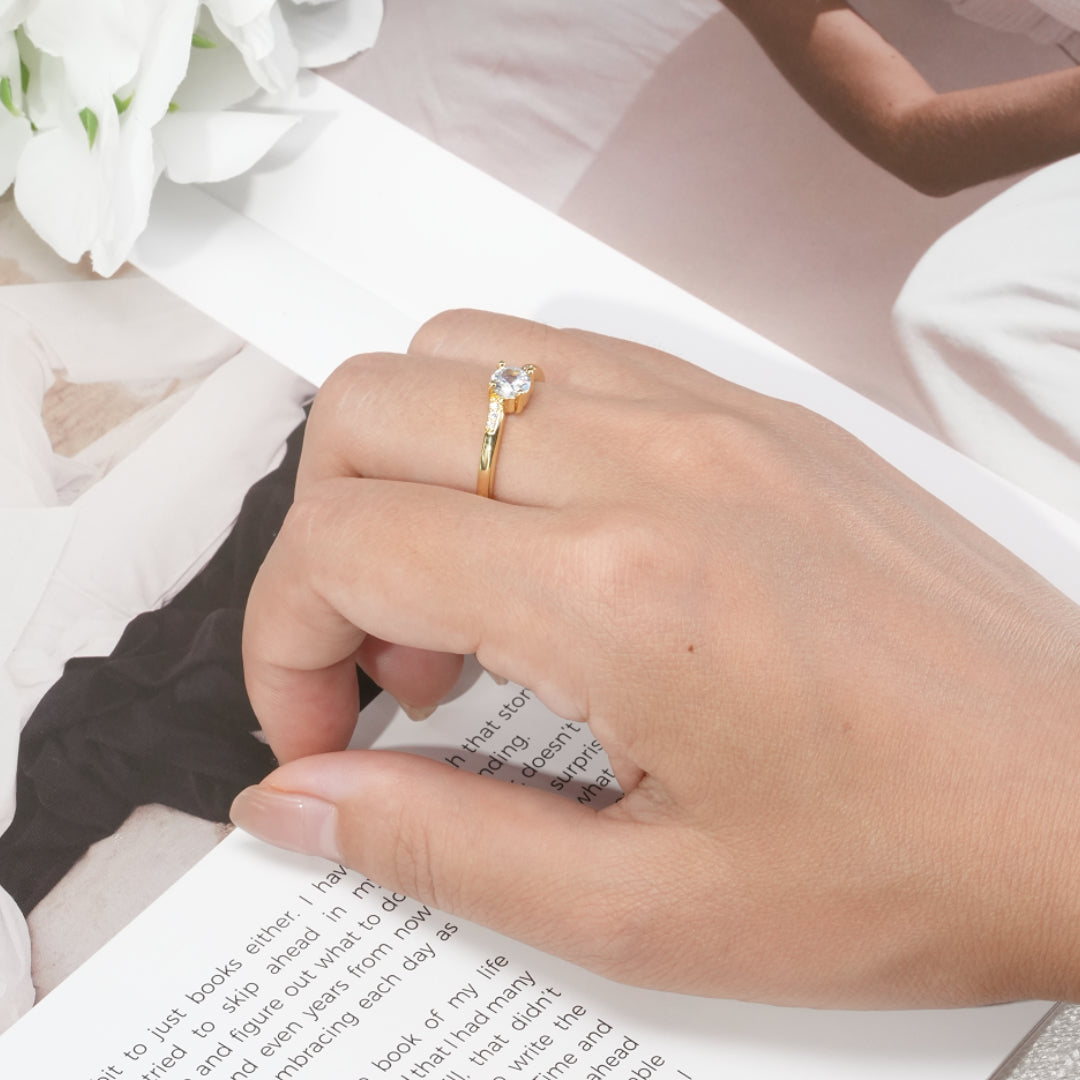 Round Cut Stone Ring with Slightly Twisted Arm Design