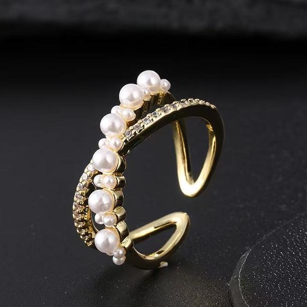 Crossed pearl and diamond open-end ring